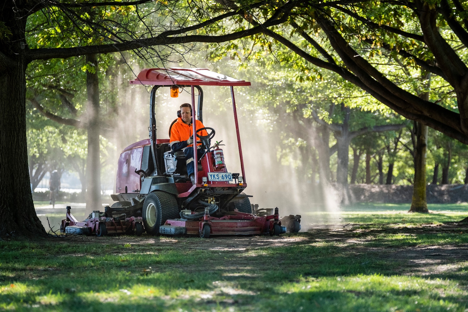 Park maintenance in golden light rays