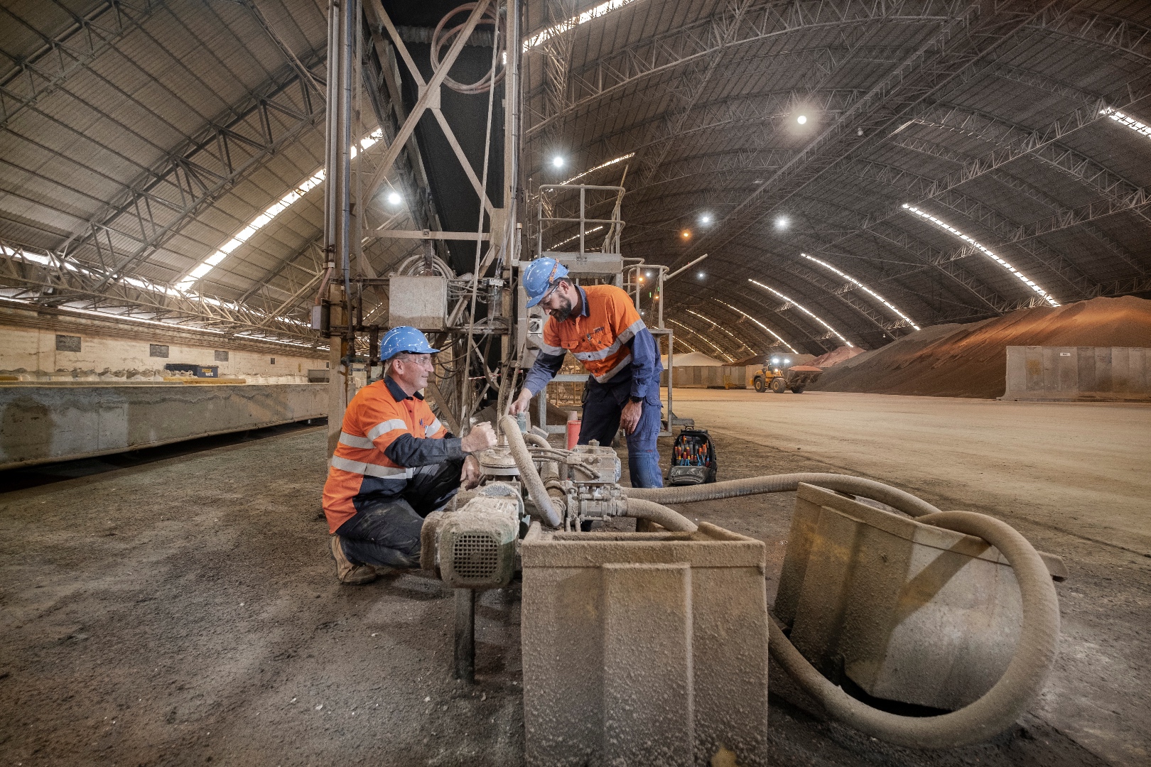 Workers in industrial dome facility